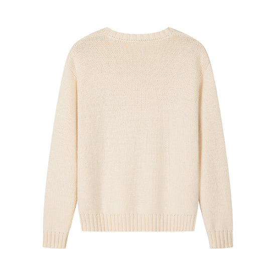 Arosris creamy khaki v-neck sweater showcasing a classic timeless silhouette, ribbed trims, and delicate vintage-inspired floral chest embroidery.