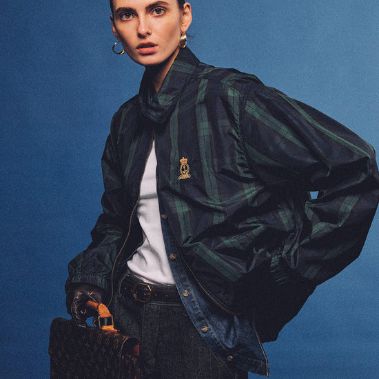 Arosris vintage green and cream horizontal striped polo shirt with a contrasting cream collar, front view. Perfectly styled for a 90s sporty chic aesthetic.