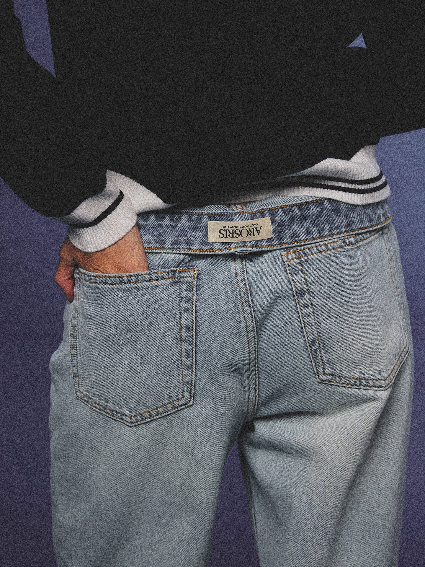 Arosris light wash high-rise wide leg denim jeans styled on a model in various poses, showcasing the structured 100% rigid cotton fit and an effortless 90s-inspired off-duty aesthetic.