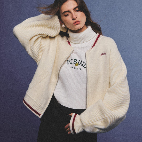 Arosris retro campus white wool varsity zip cardigan, elegantly styled with a knit turtleneck and suede accessories for an effortless 90s old money preppy aesthetic.