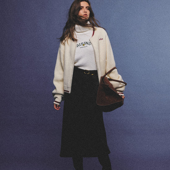 Arosris retro campus white wool varsity zip cardigan, elegantly styled with a knit turtleneck and suede accessories for an effortless 90s old money preppy aesthetic.